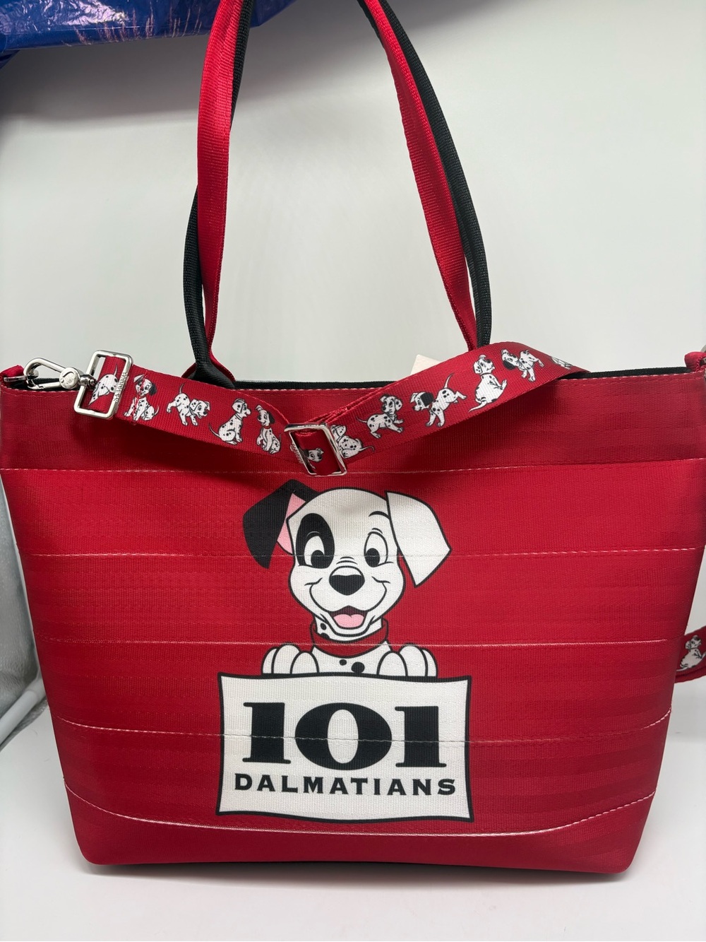 Harveys Disney Parks 101 Dalmatians Cruella Deville Red Seat Belt Tote Bag